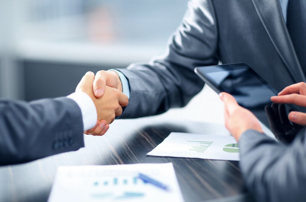 A man shaking hands with a mortgage broker for the second mortgage